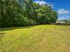 Expansive backyard with lush green lawn at 225 Woodfield Ct, Mcdonough, GA 30253