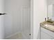 Bathroom featuring a granite countertop, tiled floors, and walk-in shower at 225 Woodfield Ct, Mcdonough, GA 30253