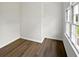 Bright bedroom with hardwood flooring and a window offering natural light at 225 Woodfield Ct, Mcdonough, GA 30253