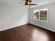 Spacious bedroom with hardwood floors and a large window at 225 Woodfield Ct, Mcdonough, GA 30253