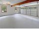 Spacious two car garage with bright windows and a white garage door at 225 Woodfield Ct, Mcdonough, GA 30253