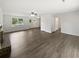 Spacious living room with hardwood floors and a brick fireplace at 225 Woodfield Ct, Mcdonough, GA 30253