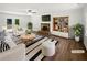 Bright living room with fireplace, modern decor, and ample seating for entertaining or relaxing at 225 Woodfield Ct, Mcdonough, GA 30253