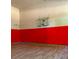 Fun game room with wood floors and a basketball hoop, perfect for active play and entertainment at 168 Harmony Grove Rd, Lilburn, GA 30047