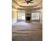 Cozy living room featuring a brick fireplace, neutral walls, and natural light from the windows at 168 Harmony Grove Rd, Lilburn, GA 30047