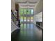 Bright living room with high ceilings, large windows, and hardwood floors create an open, inviting space at 168 Harmony Grove Rd, Lilburn, GA 30047