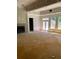 Spacious living room area featuring large windows and a cozy fireplace, awaiting personalization and final touches at 168 Harmony Grove Rd, Lilburn, GA 30047