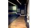 Theater room featuring wood floors, sconce lighting, and a raised platform at 168 Harmony Grove Rd, Lilburn, GA 30047
