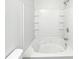 Bathroom with a large jetted bathtub and tiled walls at 2708 Parkway Trl, Lithonia, GA 30058