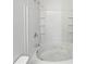 Bathroom with a large jetted bathtub and tiled walls at 2708 Parkway Trl, Lithonia, GA 30058