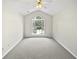 Expansive bedroom with large window and neutral carpeting at 2708 Parkway Trl, Lithonia, GA 30058