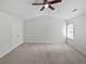 Spacious bedroom features a vaulted ceiling, plush carpet, and a ceiling fan at 2708 Parkway Trl, Lithonia, GA 30058