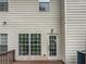Exterior view of the rear deck area with siding and windows at 2708 Parkway Trl, Lithonia, GA 30058