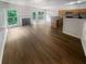 Open concept living area with hardwood floors, fireplace, and ample natural light at 2708 Parkway Trl, Lithonia, GA 30058