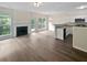 Bright and open living space featuring a fireplace and an updated kitchen at 2708 Parkway Trl, Lithonia, GA 30058