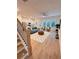 Open concept living room boasts hardwood floors, modern kitchen, and stylish furnishings at 2559 Oakbourne Ln, Smyrna, GA 30080