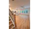 Open concept living room boasts hardwood floors and a modern kitchen with stainless steel appliances at 2559 Oakbourne Ln, Smyrna, GA 30080