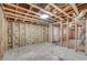 Unfinished basement featuring exposed wood framing, concrete floor, and potential for customization at 3159 Nursery Se Rd, Smyrna, GA 30082
