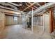 Unfinished basement offers potential for customization and additional living space with exposed pipes and beams at 3159 Nursery Se Rd, Smyrna, GA 30082