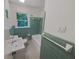 Cozy bathroom featuring a tiled shower with a bathtub and a toilet at 3159 Nursery Se Rd, Smyrna, GA 30082