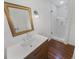 Modern bathroom with vanity, mirror, and tiled walk-in shower with glass door at 3159 Nursery Se Rd, Smyrna, GA 30082