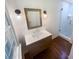 Modern bathroom vanity with drawers, a framed mirror and tiled glass shower at 3159 Nursery Se Rd, Smyrna, GA 30082