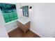Bathroom features a wood vanity, large window, and modern lighting at 3159 Nursery Se Rd, Smyrna, GA 30082