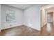 Cozy bedroom with hardwood floors, offering a bright space with view of the exterior at 3159 Nursery Se Rd, Smyrna, GA 30082