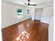 Bright bedroom with hardwood floors, ceiling fan, two windows, and closet at 3159 Nursery Se Rd, Smyrna, GA 30082