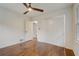Bedroom with hardwood floors, a ceiling fan, and a closet, offering a comfortable and functional space at 3159 Nursery Se Rd, Smyrna, GA 30082