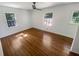 Bedroom with natural light, ceiling fan, hardwood floors, and ample space at 3159 Nursery Se Rd, Smyrna, GA 30082