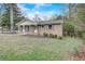 Charming brick home with a well-manicured lawn and inviting front porch, perfect for enjoying the outdoors at 3159 Nursery Se Rd, Smyrna, GA 30082