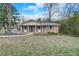 Charming brick ranch-style home featuring a well-maintained lawn and inviting front entrance at 3159 Nursery Se Rd, Smyrna, GA 30082