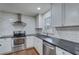 Well-lit kitchen with stainless steel appliances, subway tile backsplash, and modern cabinetry at 3159 Nursery Se Rd, Smyrna, GA 30082