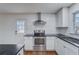 Modern kitchen features stainless steel appliances, a subway tile backsplash, and plenty of counter space at 3159 Nursery Se Rd, Smyrna, GA 30082
