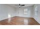 Bright, open living room with hardwood floors and ample natural light streaming through large windows at 3159 Nursery Se Rd, Smyrna, GA 30082