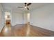 Spacious bedroom with hardwood floors, featuring a large closet and ample natural light at 3159 Nursery Se Rd, Smyrna, GA 30082