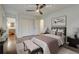 Cozy main bedroom with neutral tones, hardwood floors, and a comfortable bed with plush pillows at 3159 Nursery Se Rd, Smyrna, GA 30082