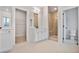 Well-lit bathroom featuring a glass shower, modern vanity, and a view of a closet and toilet at 522 Pierce Nw Ave, Atlanta, GA 30318