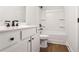 Modern bathroom featuring a tub, sleek vanity, and dark fixtures at 522 Pierce Nw Ave, Atlanta, GA 30318