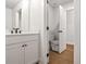 Efficient bathroom with a white vanity featuring a black faucet and an adjacent toilet at 522 Pierce Nw Ave, Atlanta, GA 30318