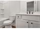 Clean bathroom featuring a white tub with shower, toilet, and vanity with a dark faucet at 522 Pierce Nw Ave, Atlanta, GA 30318