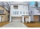 New construction with white siding, a balcony, and covered parking at 522 Pierce Nw Ave, Atlanta, GA 30318