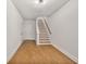 Bright foyer leading to the home's staircase, featuring beautiful wood floors at 522 Pierce Nw Ave, Atlanta, GA 30318