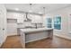 Modern kitchen featuring an island, stainless steel appliances, and a pantry at 522 Pierce Nw Ave, Atlanta, GA 30318