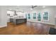 Open-concept kitchen with island, white cabinets, and stainless steel appliances at 522 Pierce Nw Ave, Atlanta, GA 30318