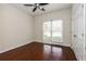 Cozy bedroom with hardwood floors and a ceiling fan at 5055 Hickory Hills Dr, Woodstock, GA 30188