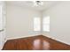 Bright bedroom with hardwood floors and natural light at 5055 Hickory Hills Dr, Woodstock, GA 30188