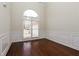 Bright dining room with large window and beautiful hardwood floors at 5055 Hickory Hills Dr, Woodstock, GA 30188