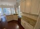 Bright and open kitchen with dark hardwood floors, granite countertops, and stainless steel appliances at 5055 Hickory Hills Dr, Woodstock, GA 30188